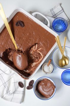 an ice cream dish with chocolate frosting in it