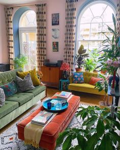 a living room filled with furniture and lots of windows