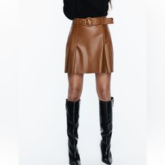 High Waisted Skirt With Self Belt Pleat Detail Back Hidden Inseam Zip Closure Whiskey Fall Season Belted Mini Skirt, Fall Belted Mini Skirt, Chic Pleated Faux Leather Bottoms, Brown Pleated Skirt For Night Out, High Waist Faux Leather Mini Skirt For Fall, Fall High Waist Belted Mini Skirt, Belted High-waist Mini Skirt For Fall, Zara Pleated Mini Skirt For Work, High Waist Belted Mini Skirt For Fall