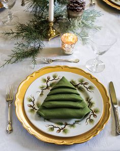 there is a plate with some food on it and silverware next to the table