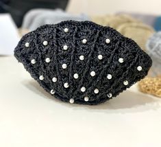 Size 27*16 cm It is shipped one day after the order is placed. It is delivered in 3-4 days by express shipping. If any change is requested, please send direct message to me. Elegant Crochet Clutch Bag For Beach, Elegant Black Crochet Bag For Beach, Elegant Black Crochet Bag As Gift, Elegant Beach Pouch Evening Bag, Elegant Beaded Crochet Bag, Crochet Clam Shell, Crochet Clam, Seashell Crochet, Pearl Purse