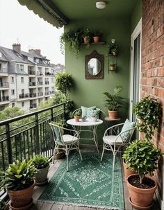 the balcony is decorated with potted plants and chairs