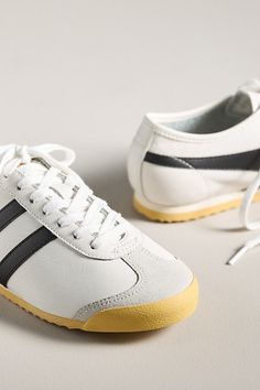 Ready...set...GOLA! Born and bred in England, the best-in-game brand leads with vintage designs and timeless flair. This sleek, low-profile sneaker features a gum sole with an integrated bumper, a short toe vamp, and an unlined soft leather upper, staying true to its original design for a standout look. | Race Sneakers by Gola in White, Women's, Size: 7.5, Leather/Rubber at Anthropologie Retro Custom Sneakers With Gum Sole For Sports, Retro Low-top Custom Sneakers With Gum Sole, Retro Low-top Custom Sneakers With Rubber Sole, Retro Sneakers For Light Sports With Rubber Sole, Retro Sneakers With Rubber Sole For Light Sports, Vintage Low-top Custom Sneakers With Gum Sole, Retro Lace-up Sneakers With Rubber Heel Cap, Retro Custom Mid-top Sneakers With Contrast Sole, Vintage Low-top Sneakers With Rubber Heel Cap