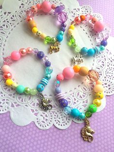 Pastel Unicorn bracelet, rainbow jewelry, MISMATCHED rainbow bracelet. kids jewellery, kids birthday party, rainbow party. SET of TEN. Party planning is already so stressful. Leave the favors up to us! PLEASE NOTE: these bracelets are mismatched, and not all 10 bracelets will be identical. Here is how it works. This listing is for a set of 10 stretchy kids bracelets. If you need more or less, please convo us and we will be more than happy to make you a custom listing. You may also check our face Gracie Animal, Homemade Beads, Birthday Party Rainbow, Kids Jewelry Diy, Kids Bead Bracelet, Pastel Accessories, Kids Jewellery, Unicorn Bracelet, Angel Bracelet