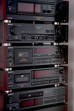 there are many stereos stacked on top of each other