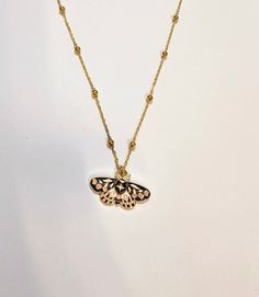 "Gorgeous gold plated moth pendant 🖤 The stunning gold plated moth has a beautiful pink, white and black enamelled flower pattern on its wings and measures approx 35mmx25mm 🖤 It's hanging on a 20\" long gold plated bobble chain 🖤 Beautiful piece, will compliment any outfit 🖤" Gold Butterfly Print Jewelry For Gift, Gold Jewelry With Butterfly Print For Gift, Pink Moth, Moth Pendant, Moth Necklace, Enamel Flower, Pendant Gold, Black Enamel, Flower Pattern