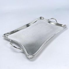 a silver serving tray on a white background