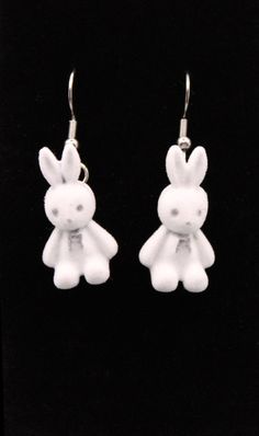 Add a touch of whimsy to your jewelry collection with these adorable Bunny Earrings. Perfect for those who love unique and playful accessories, these earrings are sure to bring a smile to your face with their charming design and comfortable wear. Product Details: Material: Soft, fuzzy material for the bunny shapes, complemented by durable stainless steel hooks. Weight: Lightweight at just 0.30oz, ensuring a comfortable wear experience. Length: 1.5 inches, providing a noticeable yet manageable ac Whimsical Hypoallergenic Dangle Earrings, Novelty Everyday Dangle Earrings, Novelty Dangle Earrings For Everyday, Adjustable Kawaii Dangle Earrings, Everyday Novelty Dangle Earrings, Playful White Dangle Jewelry, Fun Nickel-free White Earrings, Handmade Quirky Drop Earrings, Novelty White Drop Earrings