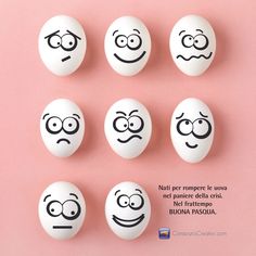 six eggs with faces drawn on them