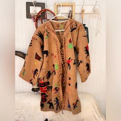 a coat hanging up on a rack in a room