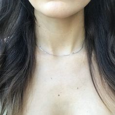 This necklace is a simple and elegant 14k solid white gold, 1.5mm anchor choker. It is great to wear alone as a classy piece or layer with other necklaces. How to Measure One's Neck for a Choker Necklace: https://youtu.be/z6XBly02mtY This item is made of recycled material. I suggest measuring around your neck with a string or tape measure to see if this necklace will fit you as desired. Custom sized necklaces can be made and a solid extension chain can also be added, please message me to inquire Dainty Silver Choker With Delicate Chain, Dainty Sterling Silver Choker With Delicate Chain, Minimalist Sterling Silver Choker Chain Necklace, Minimalist Sterling Silver Choker Necklace, Minimalist Diamond Cut Chain Necklace As Gift, Minimalist Sterling Silver Choker With Adjustable Chain, Dainty Sterling Silver Bar Necklace, Minimalist White Gold Clavicle Chain Necklace, Classic Silver Bar Necklace