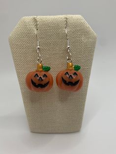 Cute little pumpkin dangle earrings. Perfect as a gift or great to wear at your next pumpkin picking or fall get together. Made with resin and stainless steel. Orange Earrings For Fall Season Gift, Fall Orange Earrings As Gift, Novelty Orange Jewelry For Gift, Orange Novelty Jewelry For Gift, Fall Season Gift Dangle Earrings, Nickel Free Orange Novelty Jewelry, Orange Novelty Jewelry For Gifts, Spooky Orange Jewelry Gift, Nickel Free Orange Halloween Earrings