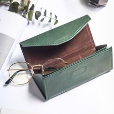 Discover the epitome of timeless style with our unisex vintage leather eyeglass case. Handcrafted to perfection, each case boasts a magnetic closure for secure storage. Elevate your eyewear experience with this artisanal accessory. MATERIAL - Made of superior 100% vegetable tanned leather, solid color,feels cosy to touch,delicate, durable. The hardware parts are made of cast molding thick hardware, top metal hardware. The stitching is well-made, firm and smooth.DIMENSIONS - 6.3L*0.51W*2.76H（inch Green Leather Rectangular Case Bag, Versatile Leather Cases, Versatile Leather Cases For Daily Use, Versatile Leather Case For Everyday Use, Leather Sunglass Case, Leather Sunglasses Case, Foldable Sunglasses, Leather Eyeglass Cases, Glasses Pouch