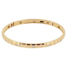 Here we have a sleek and stylish bangle from Boucheron. This piece has been forms part of the Quatre Clou de Paris collection, has been crafted from 18ct rose gold and showcases an alternating squared design consisting of a plain 3-D finish alongside 1.25 carats of diamonds. Condition: Used (Very Good) - We will happily professionally polish upon purchase so as to appear brand new Weight: 21.7 grams Size: 17 (Medium) Width: 5mm Total Diamond Weight: Approx. 1.25ct Diamond Details: Approx. Colour: G, Clarity: VS Marked: 'BOUCHERON' 'Au750' 'T17' & Serial Number Box: Plain Gift Box Cartier Bangle, Nail Bangle, Modern Bangle, Diamond Bangles, Modern Bracelets, White Gold Bracelet, Diamond Bangle, Yellow Gold Bracelet, Pearl Diamond