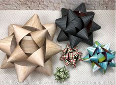 four wooden stars are sitting on the floor next to each other and one is made out of wood