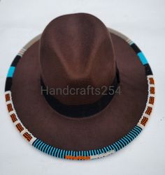 This listing is for beaded edge fedora hat. The beads go around the whole edge. I have made a beautiful pattern that goes all round. Instead of having a plain fedora hat, this one is more beautiful with beads. You can select a different color for the fedora hat but the beads color and pattern remains the same as shown on the photo. I ship via DHL express. Beaded Wide Brim Fedora For Festivals, Wide Brim Beaded Fedora For Festival, Western Beaded Fedora With Curved Brim, Western Fedora With Beaded Curved Brim, Beaded Fedora Hats For Country Events, Beaded Fedora For Country Events, Western Brown Beaded Hat, Western Style Brown Beaded Hat, Traditional Brown Beaded Hat