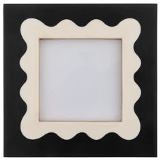 a black and white frame with scalloped edges