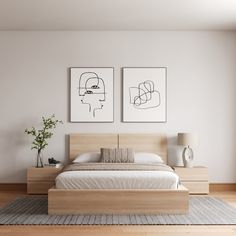 two paintings hang on the wall above a bed in a white room with hardwood floors