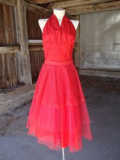 This is a red lace and tulle halter top and full skirt 2 piece outfit from the 1950's.  The halter top opens on the side with a well working metal separating zipper.  The skirt has lace and tulle layers, with an acetate underskirt.  This outfit was home sewn, and the closure on the skirt is a little wacky.  It works, but is a bit weird.  Comes from a smoke free home.Measurements:  Halter Top:  Bust:  36"   Waist:  25"   Length:  23.5"                              Skirt:  Waist:  26"   Hip:  Open 2 Piece Outfit, Full Skirt Dress, Brown Silk, 1950s Dress, Red Lace, Lace Sleeves, Piece Dress, Full Skirt, Halter Formal Dress