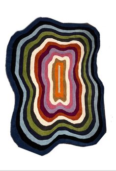 a multicolored rug with an oval shape