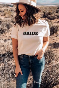 Bride to be shirts are a cute outfit for a bachelorette party!  Gift her this cute tshirt at her engagement or bridal shower. Custom Text Short Sleeve Tops For Wedding, Cotton Short Sleeve Wedding Shirt, Relaxed Fit Crew Neck Top For Bachelorette Party, Spring Wedding Crew Neck Top, Cotton Tops With Letter Print For Bachelorette Party, Custom Text Crew Neck T-shirt For Summer, Relaxed Fit Crew Neck Top For Wedding, White Bridal T-shirt With Short Sleeves, White T-shirt With Custom Text