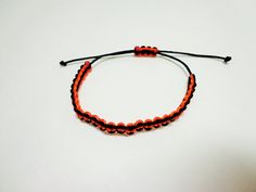 ------- Other Colors are available upon request--------- Micro paracord bracelet made from micro paracord It is made with black and orange colors This bracelet is fully adjustable and is easy to take on and off If purchasing please leave a tight measurement of your wrist in the comments of your order and we will add the appropriate amount of extra paracord to make your bracelet fit well Black Macrame Beaded Bracelets Casual, Casual Black Macrame Beaded Bracelets, Adjustable Orange Braided Bracelet With Sliding Knot, Handmade Black Paracord Braided Bracelet, Adjustable Black Paracord Braided Bracelet, Black Nylon Cord Friendship Bracelets With Sliding Knot, Black Casual Friendship Bracelets With Adjustable Cord, Casual Black Paracord Bracelet, Duck Call Lanyard