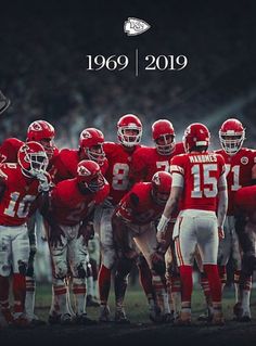 a group of football players standing next to each other