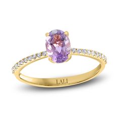 A mesmerizing oval-cut natural amethyst gemstone shimmers with elegance in the center of this gorgeous women's ring from the Lali Jewels Collection. Brilliant round diamonds line the band to complete the look. Fashioned in 14K yellow gold, the total diamond weight is 1/10 carat. Amethyst Engagement Ring, Amethyst Ring Engagement, Jared The Galleria Of Jewelry, Gold Price, Gemstone Engagement Rings, Amethyst Stone, Amethyst Gemstone, Diamond Stone, Bridal Rings