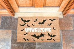 a welcome mat with bats on it