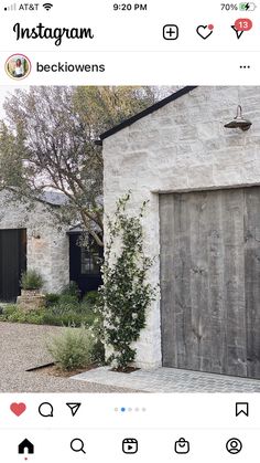 the instagram page shows an image of a house and its front door, which is surrounded by greenery