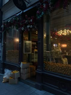 a store front with lots of fruits and vegetables on display in it's windows