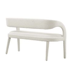 a white bench sitting on top of a white floor