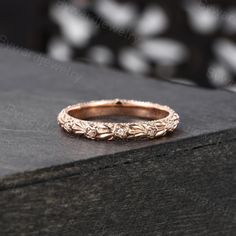 a rose gold wedding band with diamonds