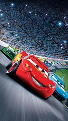 the cars are racing down the road in front of an audience at a movie theater