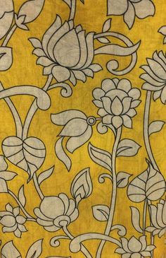 a yellow background with white flowers and leaves on the bottom right corner is an intricate design