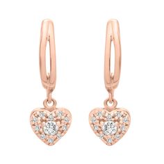 With a heart-shaped charm filled with stunning diamonds, the Etta earrings add a romantic touch to every outfit. These beautiful diamond heart drop earrings will add character and sparkle to your everyday collection.  Available in 10K and 14K yellow gold, white gold, and rose gold Length: 15. 94 mm / Width: 5. 42 mm  SI1 Diamond Clarity  H-I Diamond Color  Total Carat weight: 1/10 CT  Ethically sourced materials and conflict-free diamonds  Fully compliant with The Kimberley Process To keep your Heart Dangle Earrings, Heart Drop Earrings, Diamond Color, Rose Gold Earrings, Diamond Heart, Conflict Free Diamonds, Diamond Clarity, Colored Diamonds, Dangle Earrings