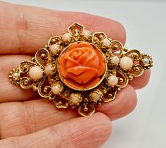 "Pink Brooch, Pink Pendant, Angel Skin Coral Brooch, Pink Coral Pendant, & Red Coral, Sea Coral, Cultured Pearls, Rose Pendant, Rose Brooch, Floral Pendant, Floral Brooch, Convertible Brooch/ Pendant, 14K Gold. This gorgeous vintage Brooch is finely crafted in solid 14K Yellow gold (stamped and also carefully tested and guaranteed). The center beautiful carved coral flower measures 16mm. It is complimented with ten Angel skin pearls of 3mm and two corals of 4mm. Two 2mm each cultured pearls Elegant Rose Design Brooches For Anniversary, Rose Colored Wedding Brooch Jewelry, Elegant Rosette Brooches As A Gift, Rose Gold Brooch With Rose Design For Weddings, Rose Coral Jewellery, Vintage Rose Brooch Jewelry, Coral Pendants Gold, Vintage Rose Jewelry With Brooch, Elegant Red Coral Pendant Jewelry