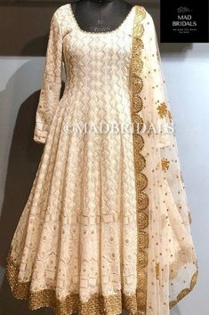 Pure Chikankari Anarkali with very heavy and intricate murri embroidery, embellished with handwork allover. It comes with Top, Bottom and Dupatta. The top is made in Georgette Fabric and bottom pyjami or georgette salwar or georgette sharara. The color of the actual product may slightly differ from the pictures. Hand embroidered items may have some loose threads. Top- Made in Georgette fabric. Thread and sequins Embroidery. Bottom- Pajami or Georgette Salwar or Georgette Sharara Dupatta- Net fabric sequins work. Fabric: Pure Chikankari Work: Chikankari Wash: Hand Wash/Dry Clean Product color may slightly vary due to photographic lighting sources or your monitor settings. NOTE: All our items are handmade and specially customized for our beautiful customers. Please expect minor variations in Luxury Chikankari Embroidery Anarkali Set, Silk Chikankari Suits, Luxury Formal Anarkali Set With Chikankari Embroidery, Luxury Chikankari Anarkali Set For Diwali, Luxury Unstitched Anarkali Set With Chikankari Embroidery, Luxury Floor-length Gown With Chikankari Embroidery, Luxury Floor-length Dresses With Chikankari Embroidery, Luxury Bollywood Chikankari Embroidered Dress, Luxury Chikankari Embroidery Dress For Reception