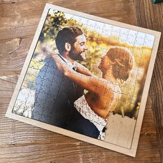 a jigsaw puzzle with a photo of a couple holding each other on it