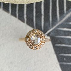 a diamond ring sitting on top of a table