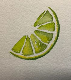 a watercolor drawing of a lime slice on white paper with green and yellow highlights