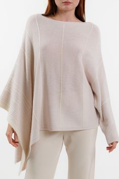 TN15F22 - 100% Cashmere (58% cashmere / 42% recycled cashmere) - Long sleeve with rib cuff - Poncho style sleeve - Weave stitch detail - Textured stripe detail - Relaxed fit - Also available in the color Woodland - Model is 5'9" wearing a size Small Winter Cashmere Sweater In Neutral Color, Neutral Cashmere Sweater For Winter, Winter Cashmere Fine Knit Tops, Winter Fine Knit Cashmere Tops, Winter Cashmere Tops With Ribbed Collar, Winter Merino Wool Tops With Ribbed Cuffs, Spring Cashmere Tops With Ribbed Cuffs, Fall Cashmere Sweater In Winter White, Winter White Cashmere Sweater For Fall