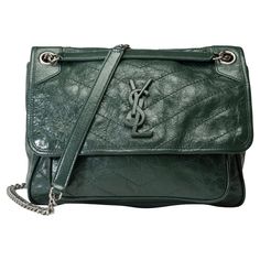 Saint​ ​Laurent​ ​Niki​ ​medium​ ​model​ ​shoulder​ ​flap​ ​bag​ ​in​ ​green​ ​crinkled​ ​leather,​ ​aged​ ​silver​ ​metal​ ​trim,​ ​a​ ​transformable​ ​chain​ ​handle​ ​in​ ​aged​ ​silver​ ​metal​ ​allowing​ ​a​ ​shoulder​ ​or​ ​crossbody​ ​carry Closure​ ​by​ ​YSL clasp​ ​in​ ​metal​ ​green Black​ ​canvas​ ​lining,​ ​one​ ​patch​ ​pocket,​ ​one​ ​zip​ ​pocket Signature:​ ​"Saint​ ​Laurent​ ​Paris​ ​Made​ ​in​ ​Italy" Dimensions:​ ​28x20x9​ ​cm​ ​(11x7.9x3.5​ ​Inches) Shoulder​ ​strap​ ​length:​ ​55​ ​cm​ ​(21.7​ ​inches) Reference:​ ​102024 General​ ​condition:​ ​7/10 In​ ​very​ ​good​ ​condition​ ​despite​ ​wear​ ​marks​ ​on​ ​the​ ​leather​ ​(scratches,​ ​wear​ ​at​ ​corners),​ ​interior​ ​canvas​ ​(dirt)​ ​and​ ​trim​ ​(scratches,​ ​slightly​ ​worn​ ​YSL​ ​clasp​ ​logo) Saint Laurent Paris, Metal Trim, Black Canvas, Green Bag, Flap Bag, Patch Pocket, Fashion Handbags, Zip Pockets, Yves Saint Laurent