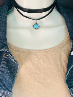 "The adorable black choker with synthetic turquoise charm is made with an ultra soft genuine leather , hand made in the USA. This choker is the perfect accessory for any womens wardrobe.   This choker is a great womens gift.  The necklace is adjustable with a length of 14\" to 16\"" Handmade Adjustable Turquoise Choker Necklace, Adjustable Bohemian Turquoise Choker Necklace, Unique Adjustable Turquoise Choker, Adjustable Black Choker, Black Bohemian Choker With Adjustable Cord, Turquoise Charm, Black Choker, Women's Wardrobe, Charm Necklace