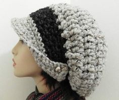 a crocheted hat is shown on top of a mannequin's head