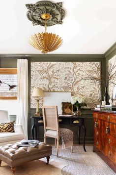 a living room filled with furniture and a chandelier