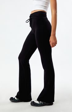 Make a stylish statement with the Low Rise Cinched Flare Pants from PacSun, featuring a unique fold-over waistband with a cinched front detail for added flair. Designed with a flattering low-rise fit and flared leg openings, they offer a trendy twist to elevate your everyday ensemble with effortless sophistication.


	9" rise
	30" inseam
	Low-rise
	Fold-over waistband
	Cinched front detail
	Flared leg openings
	Tight fit
	95% cotton, 5% spandex
	Hand wash
	Model is wearing a size small
	Model measurements: 5’10” height, 31” bust, 23.5” waist, 34.5” hips Fitted Pants With Drawstring, Chic Fitted Solid Sweatpants, Chic Fitted Sweatpants, Stretch Straight Leg Bottoms With Drawstring, Stretch Straight Leg Pants With Drawstring, Trendy Fitted Pants With Drawstring, Stretch High Waist Bottoms With Tie Waist, Black Flare Bottoms For Loungewear, Fitted Black Bottoms With Drawstring