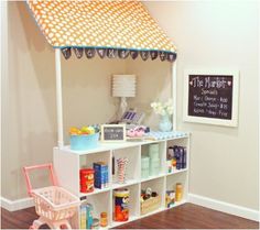 a play house made out of an old bookcase