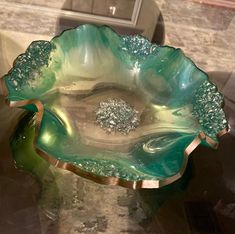 a glass bowl sitting on top of a table