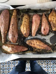 there are many different types of food on the trays that is ready to be cooked